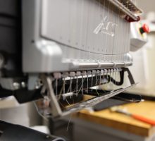 Close up of needles on an embroidery machine